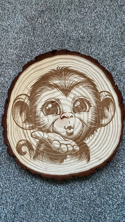 monkey blowing a kiss wooden slice art