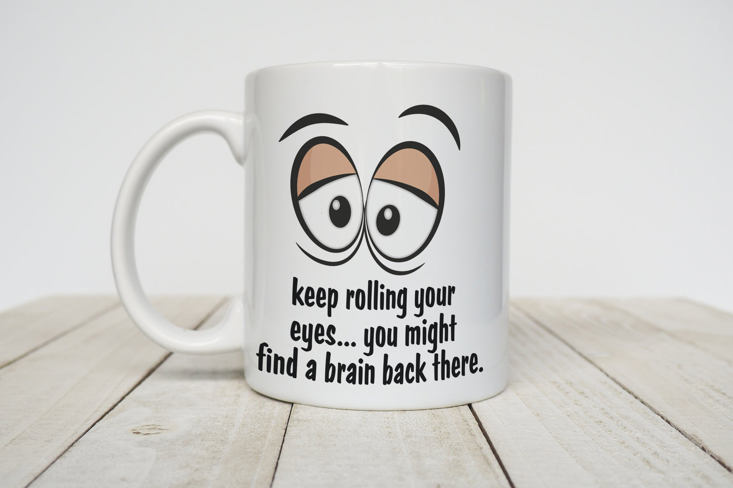 Keep rolling your eyes.... you might find a brain back there white mug image 0