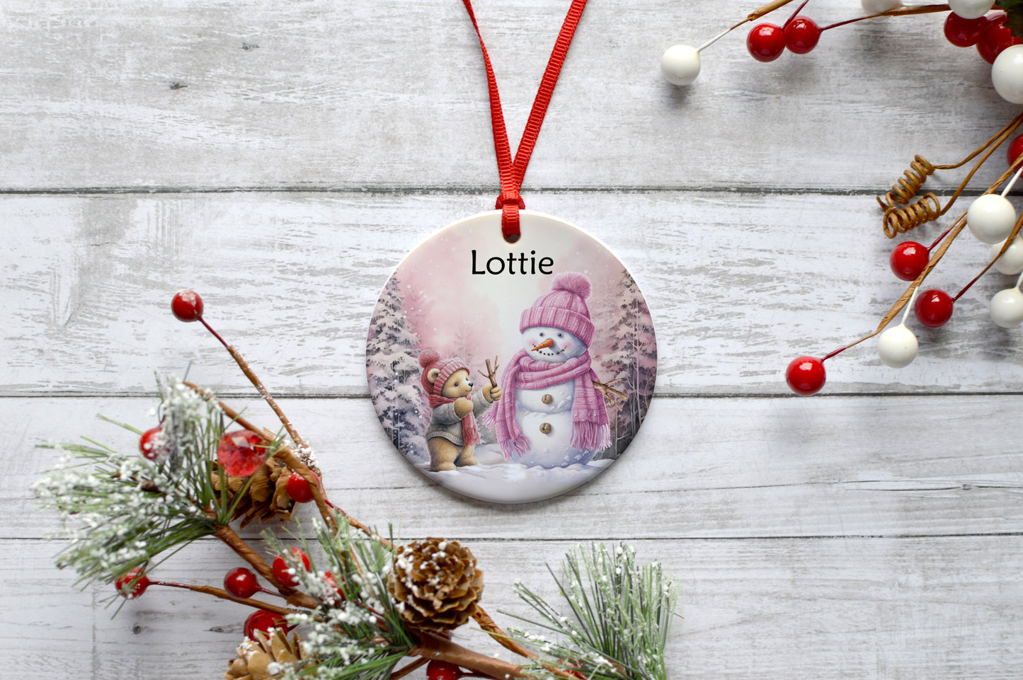 Teddy bear building a snowman pink ceramic hanging decoration image 0